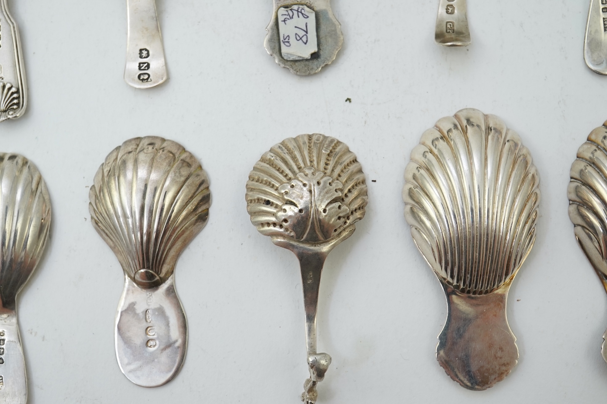 Ten assorted 19th and 20th century silver caddy spoons, with shell or fluted bowls